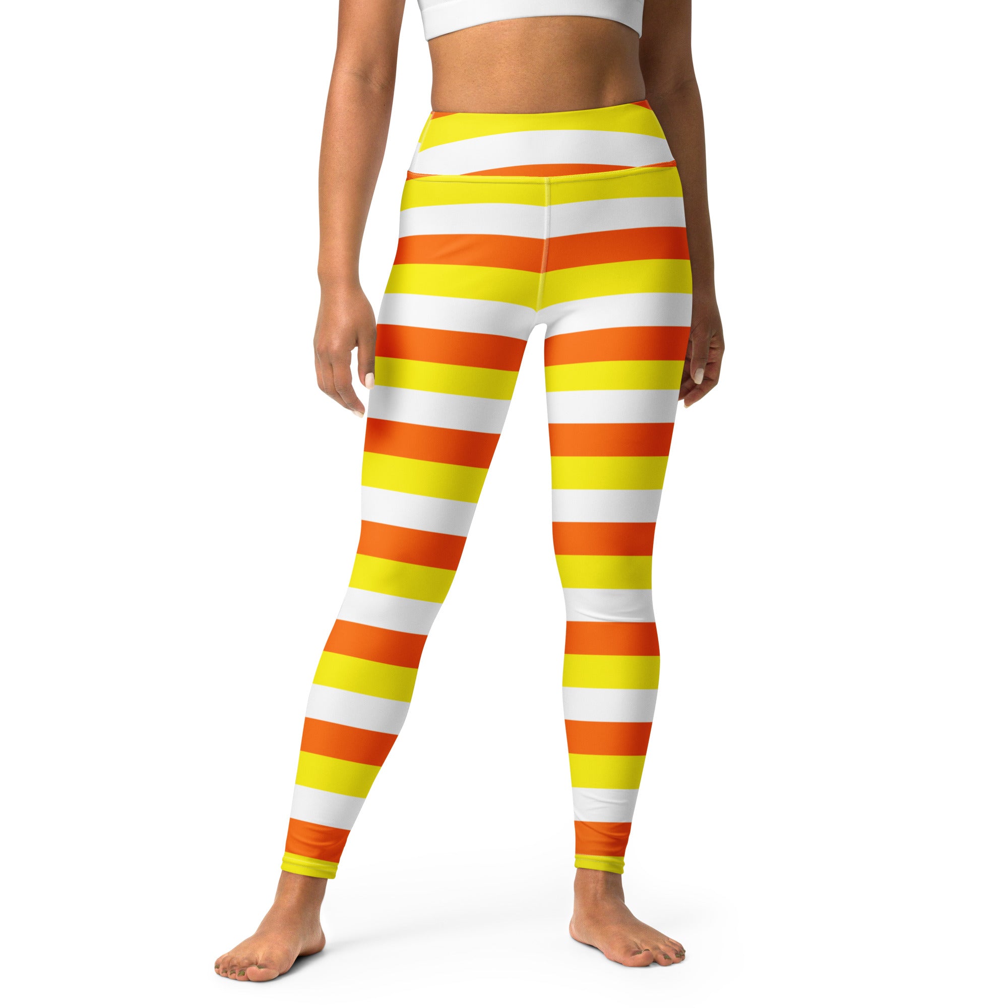 Women’s candy corn striped high-waisted buttery soft yoga leggings in vibrant orange yellow and white horizontal stripes