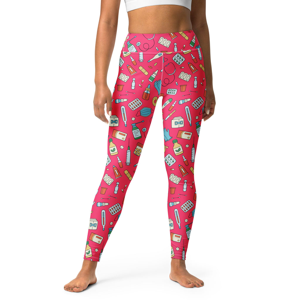 Vibrant pink high-waisted buttery soft yoga leggings with playful illustrated medical supplies pattern for women nurses