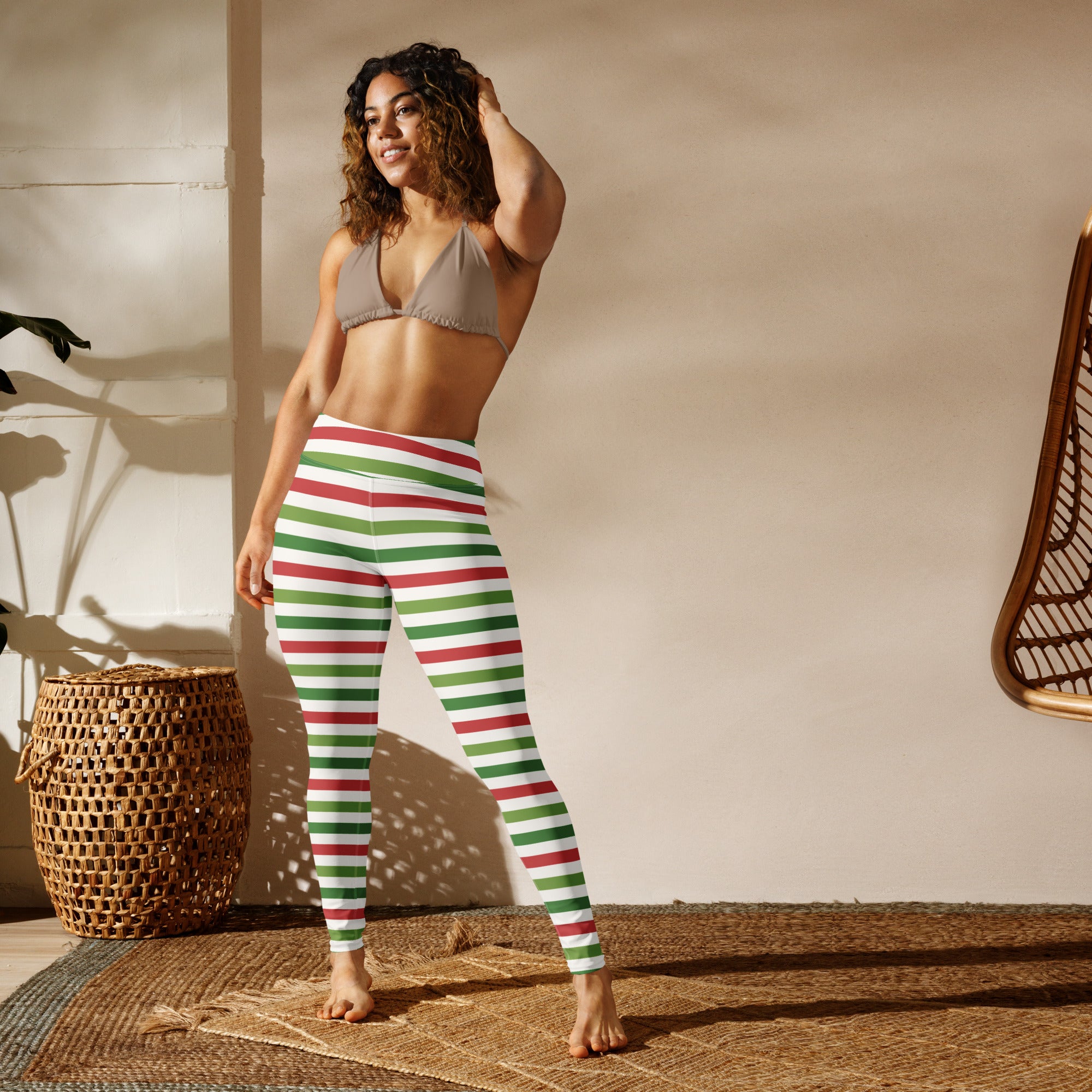 Women’s striped Christmas buttery soft yoga leggings in red and green with a snug form-fitting design