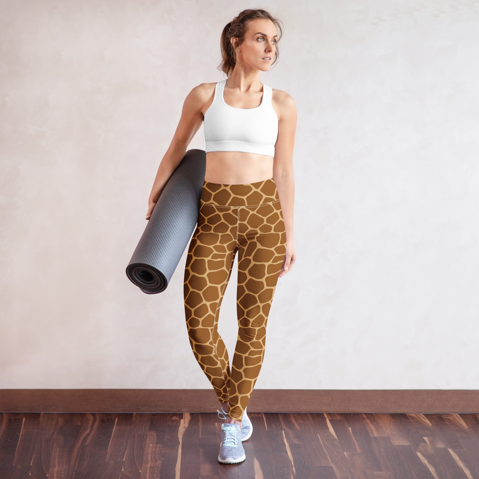 Brown giraffe print buttery soft high waisted yoga leggings for women shown from the back side