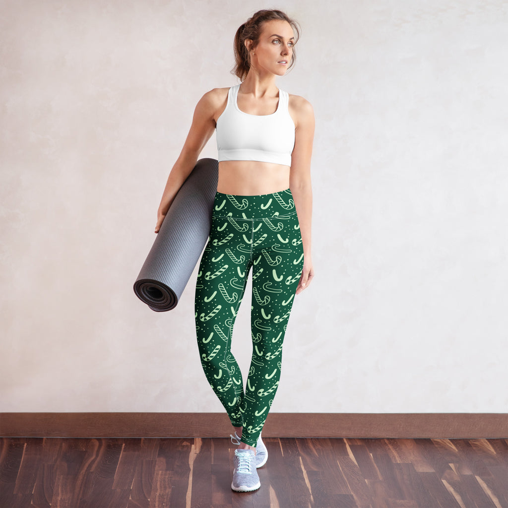 Women’s buttery soft green yoga leggings with white candy cane pattern perfect for christmas workouts