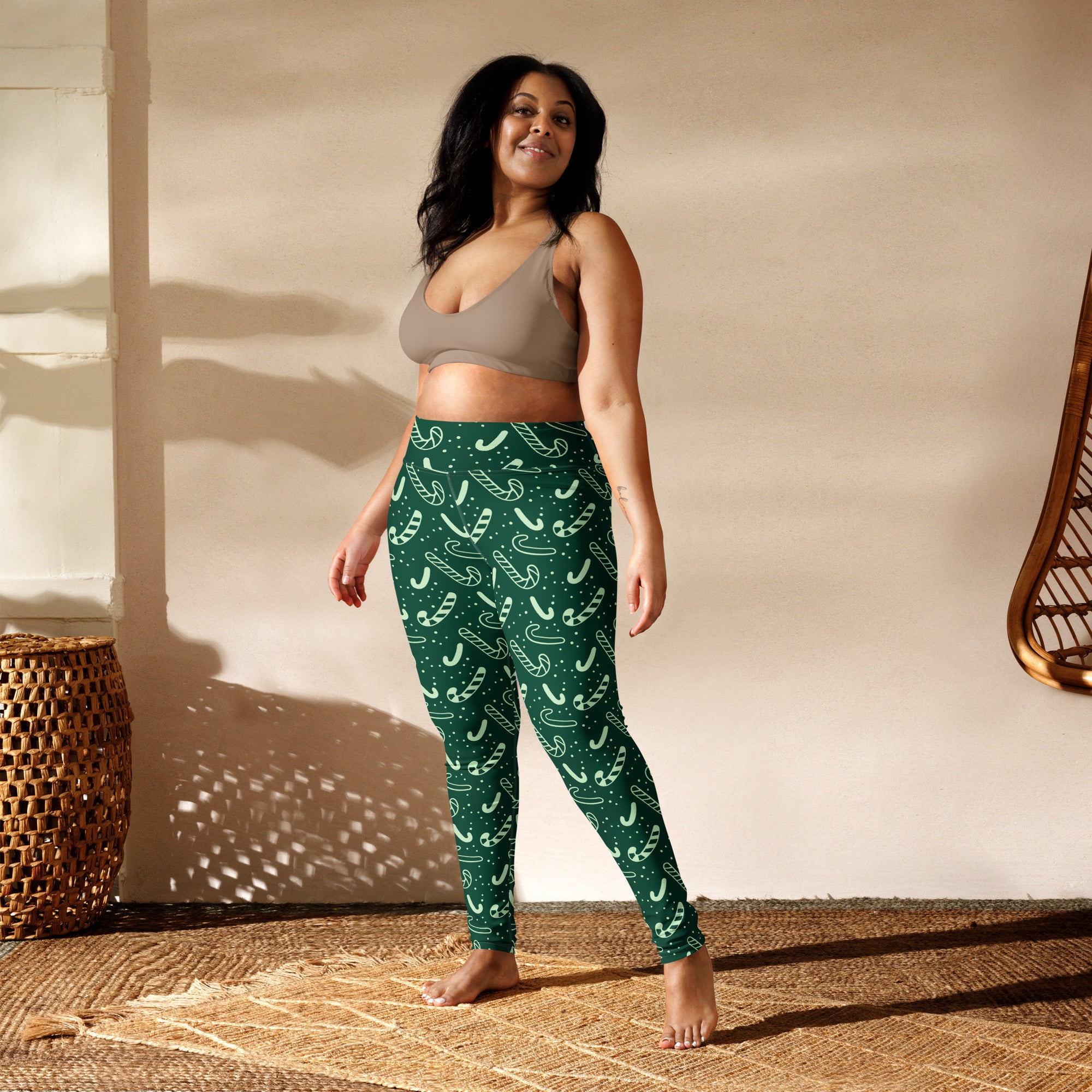 Women’s green buttery soft yoga leggings with white candy cane pattern for christmas wear