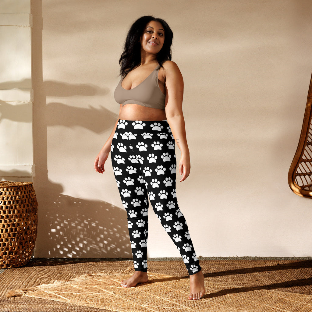 Women’s black buttery soft yoga leggings with white paw print pattern for comfortable activewear