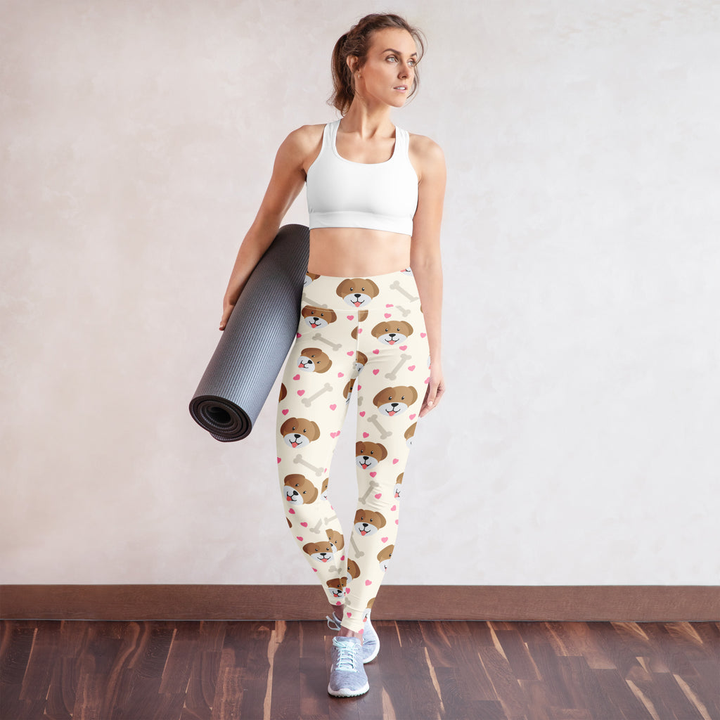 Women’s cream-colored buttery soft yoga leggings with brown puppy face and pink heart pattern