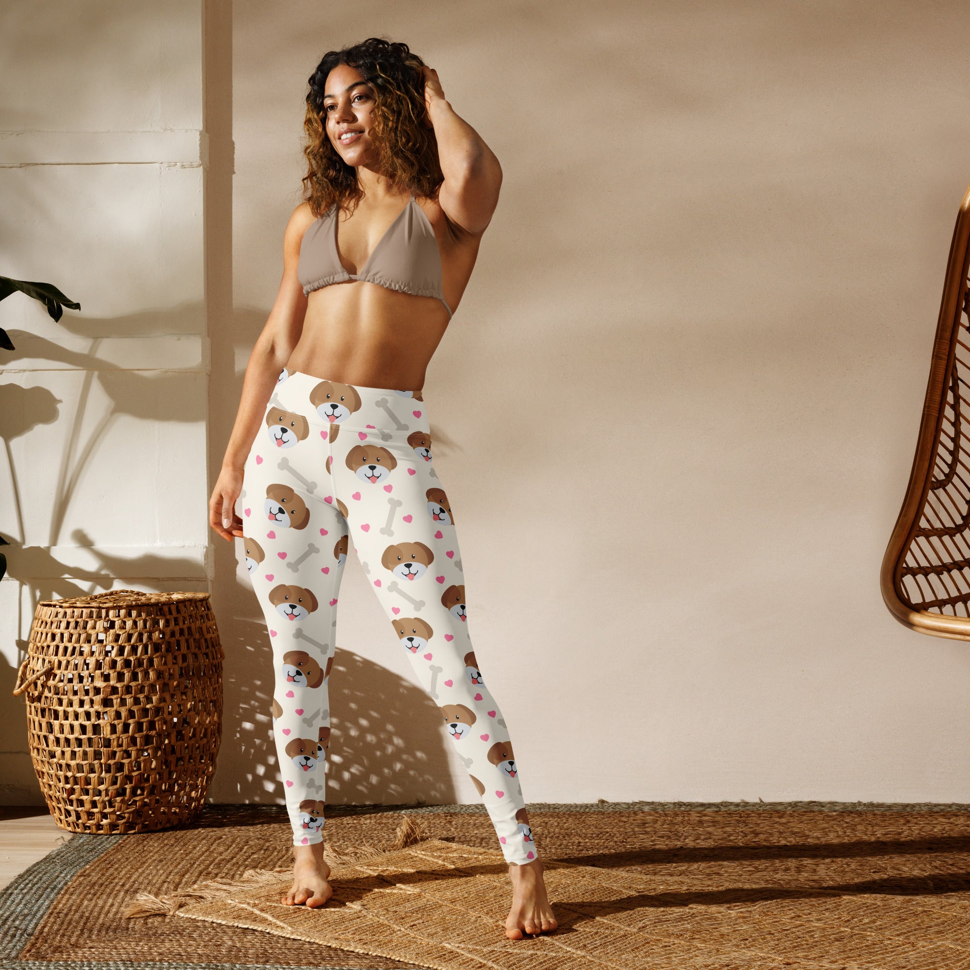 White buttery soft yoga leggings featuring a playful pattern of brown puppy faces pink hearts and bone shapes