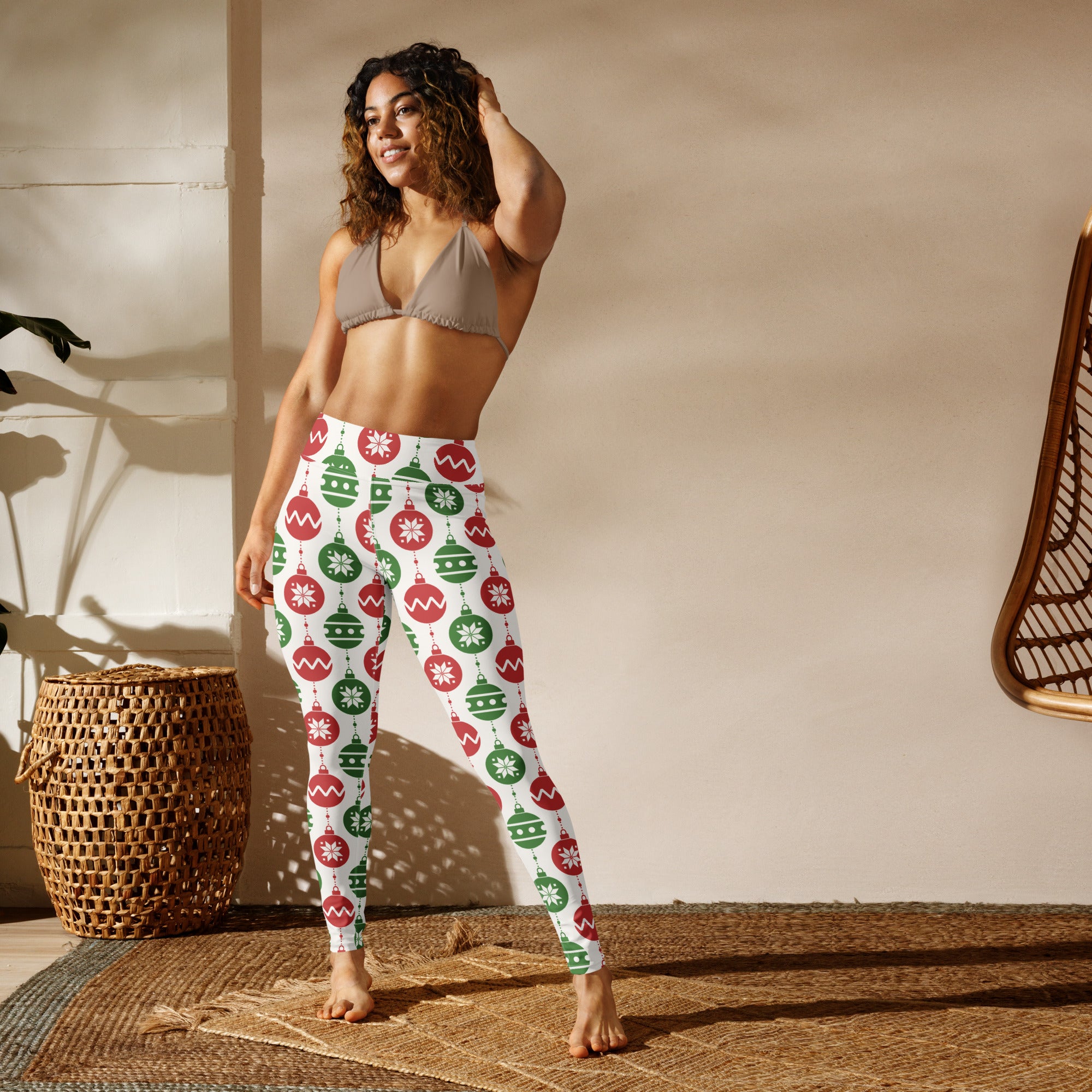 White women’s buttery soft yoga leggings with festive red and green christmas ornament and snowflake pattern