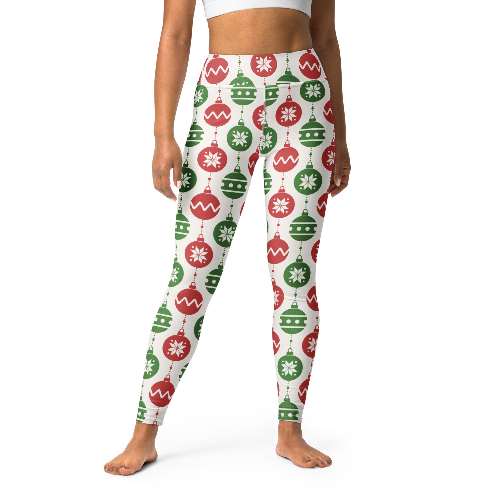 White high-waisted buttery soft yoga leggings with a festive red and green christmas ornament pattern and snowflake details