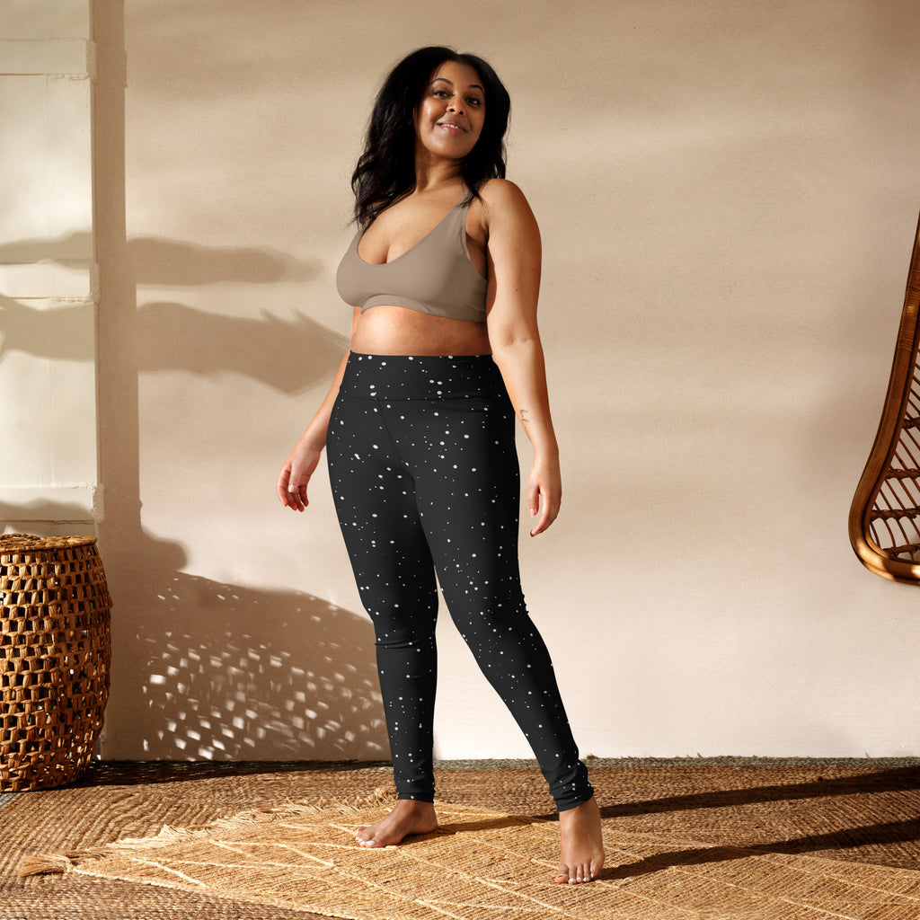 Women’s black buttery soft yoga leggings with subtle white snowflake pattern for winter workouts