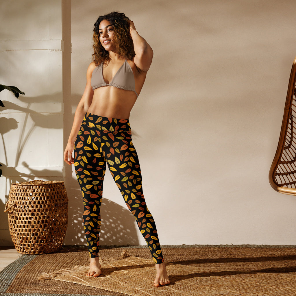 Black women’s buttery soft yoga leggings with vibrant multicolored gold autumn leaf pattern