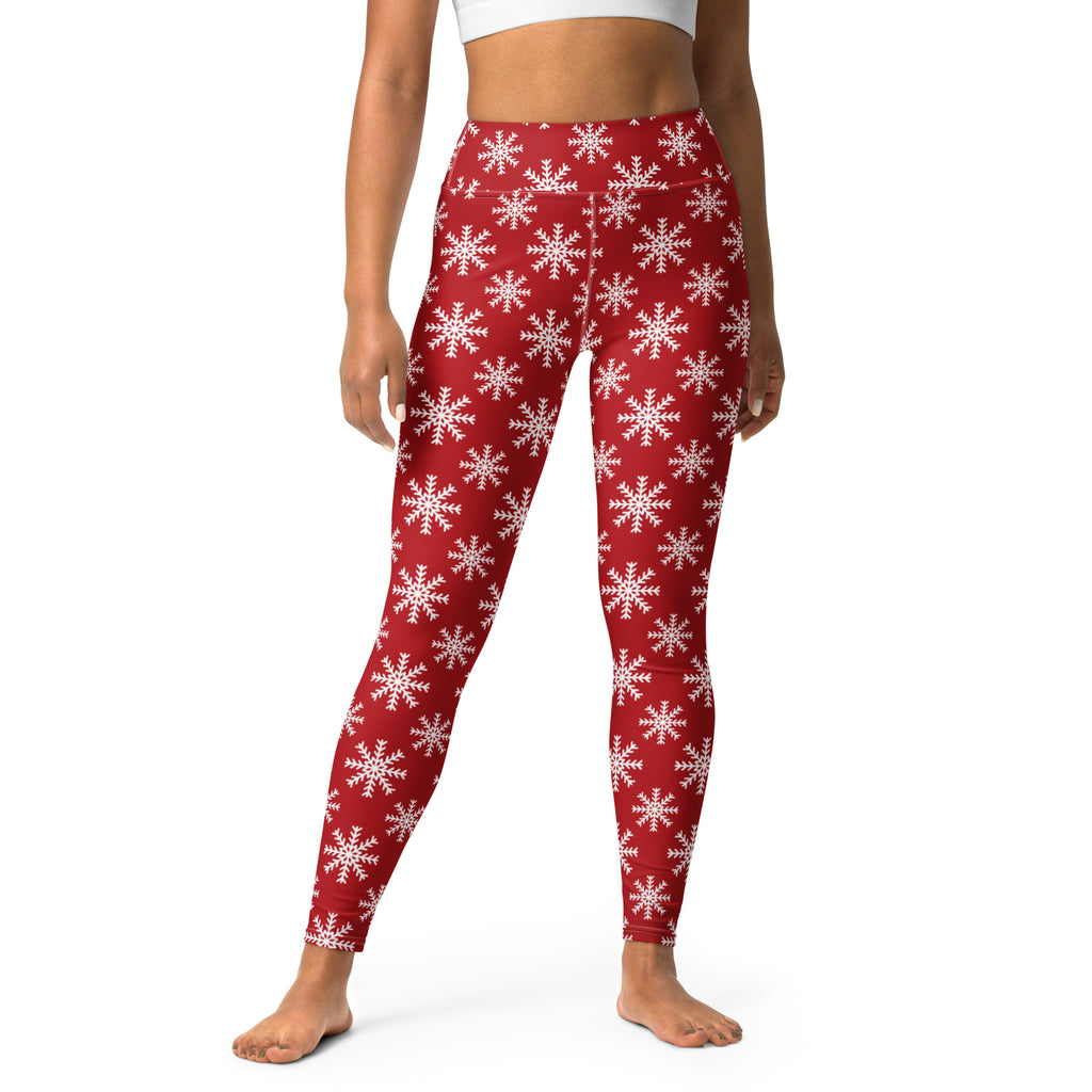 Women’s red buttery soft yoga leggings with a repeating white snowflake pattern for winter fitnesswear