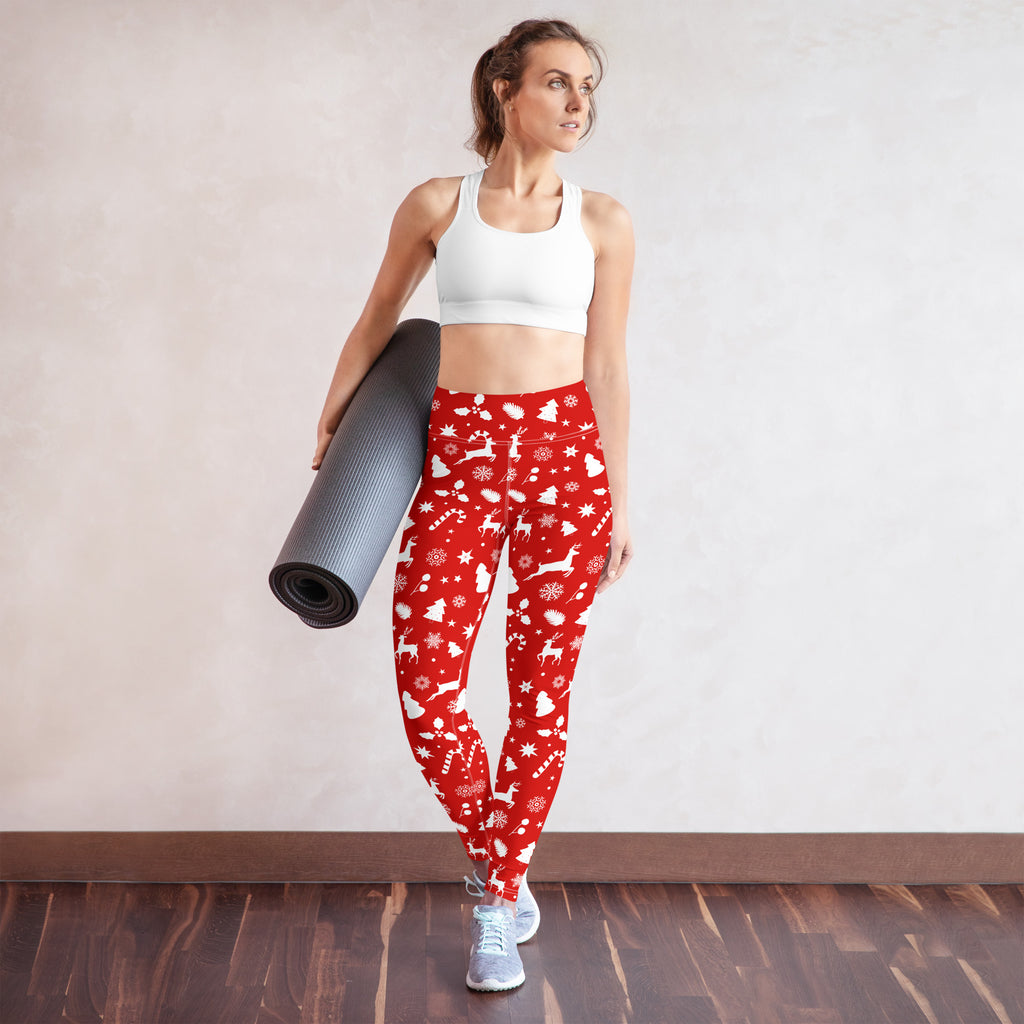 Women’s red christmas buttery soft yoga leggings with white reindeer snowflakes and candy canes on stretchy fabric