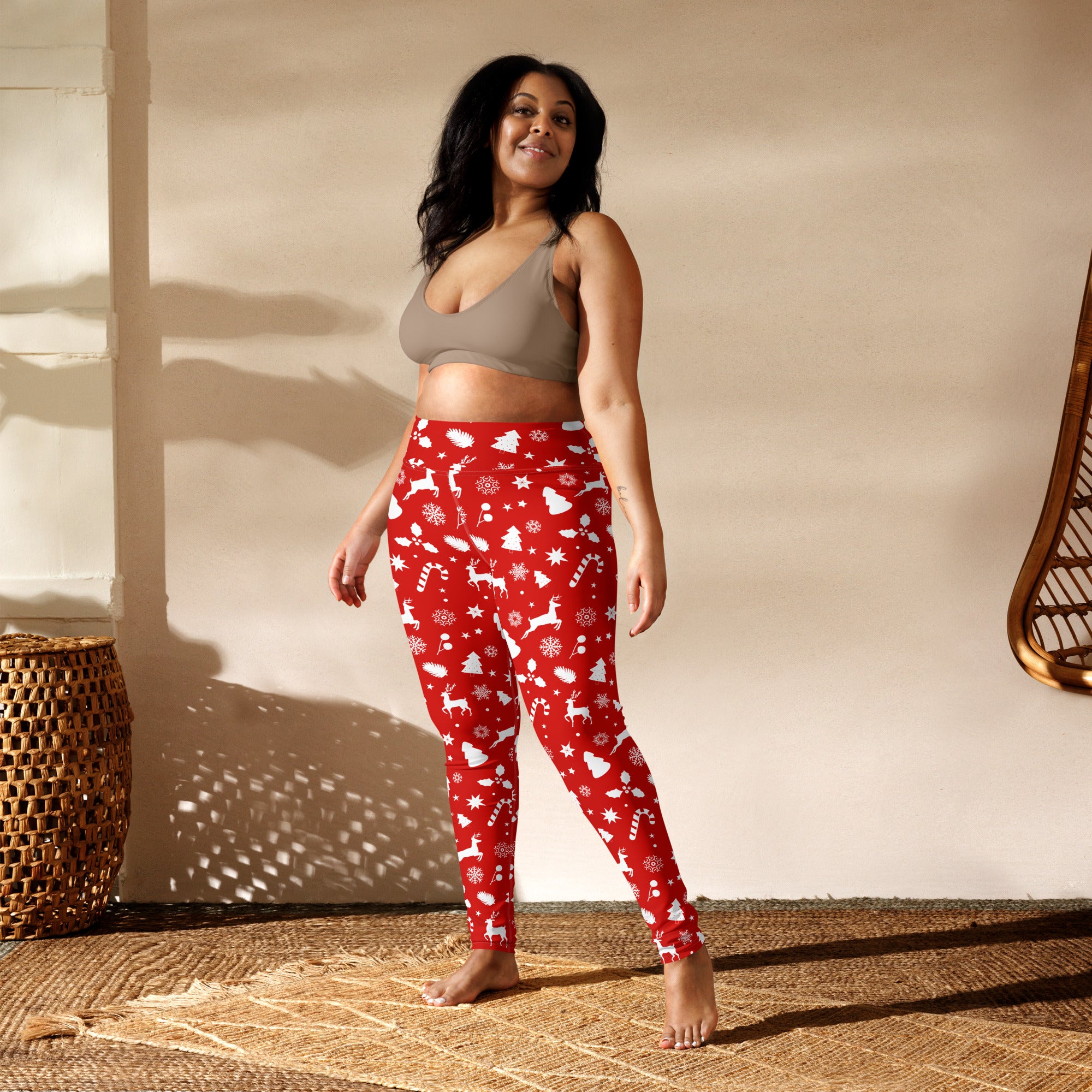 Women’s red christmas buttery soft yoga leggings with white reindeer snowflakes and candy cane patterns
