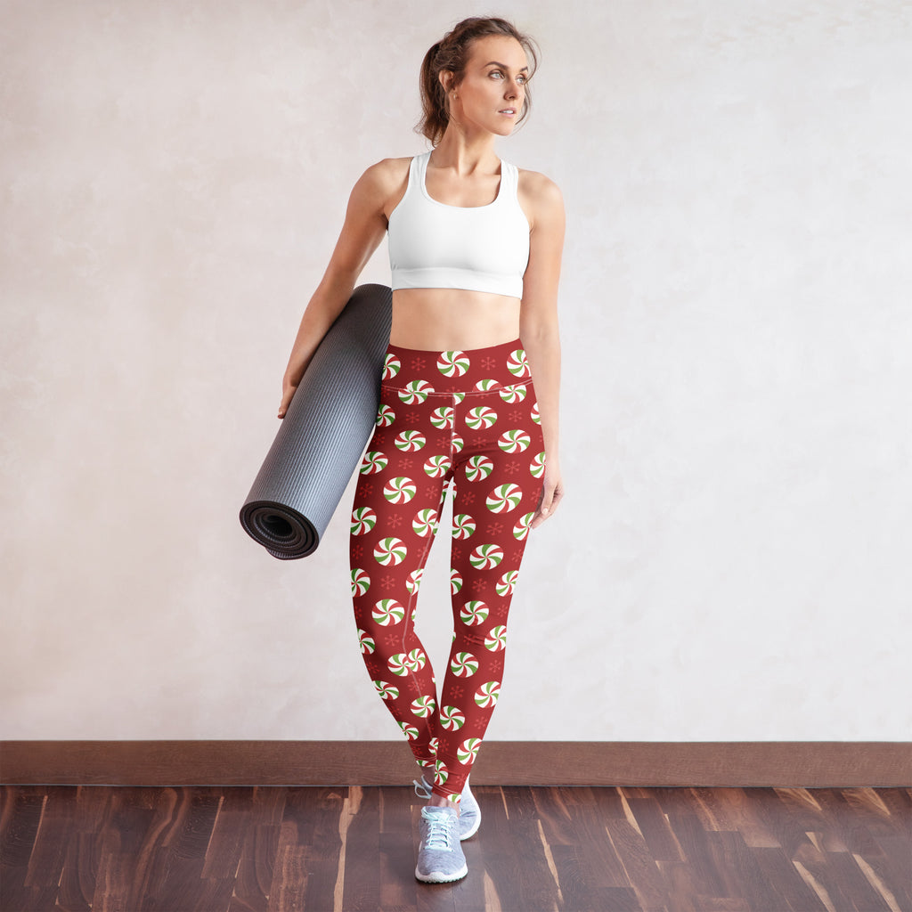 Women’s buttery soft red yoga leggings with festive green and white peppermint candy pattern for christmas