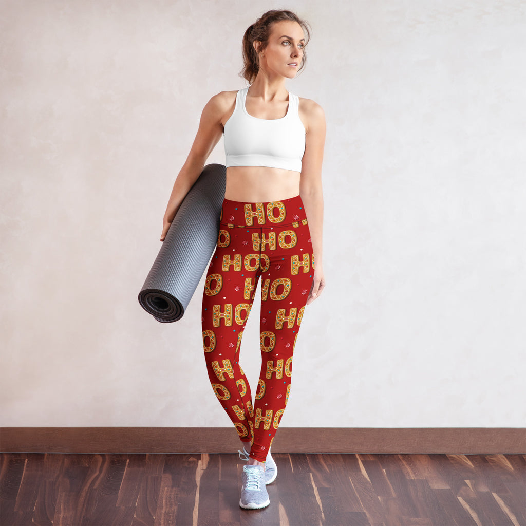 Women’s red buttery soft yoga leggings with festive gold ho ho ho lettering and small snowflake accents for christmas