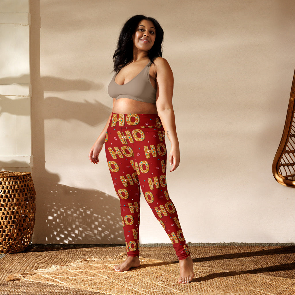 Women’s red buttery soft yoga leggings with gold ho ho ho pattern and decorative dots for Christmas wear
