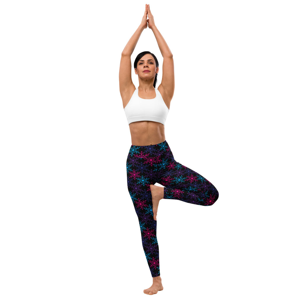 Women’s neon snowflake winter buttery soft black leggings with vibrant pink and teal snowflake pattern for yoga