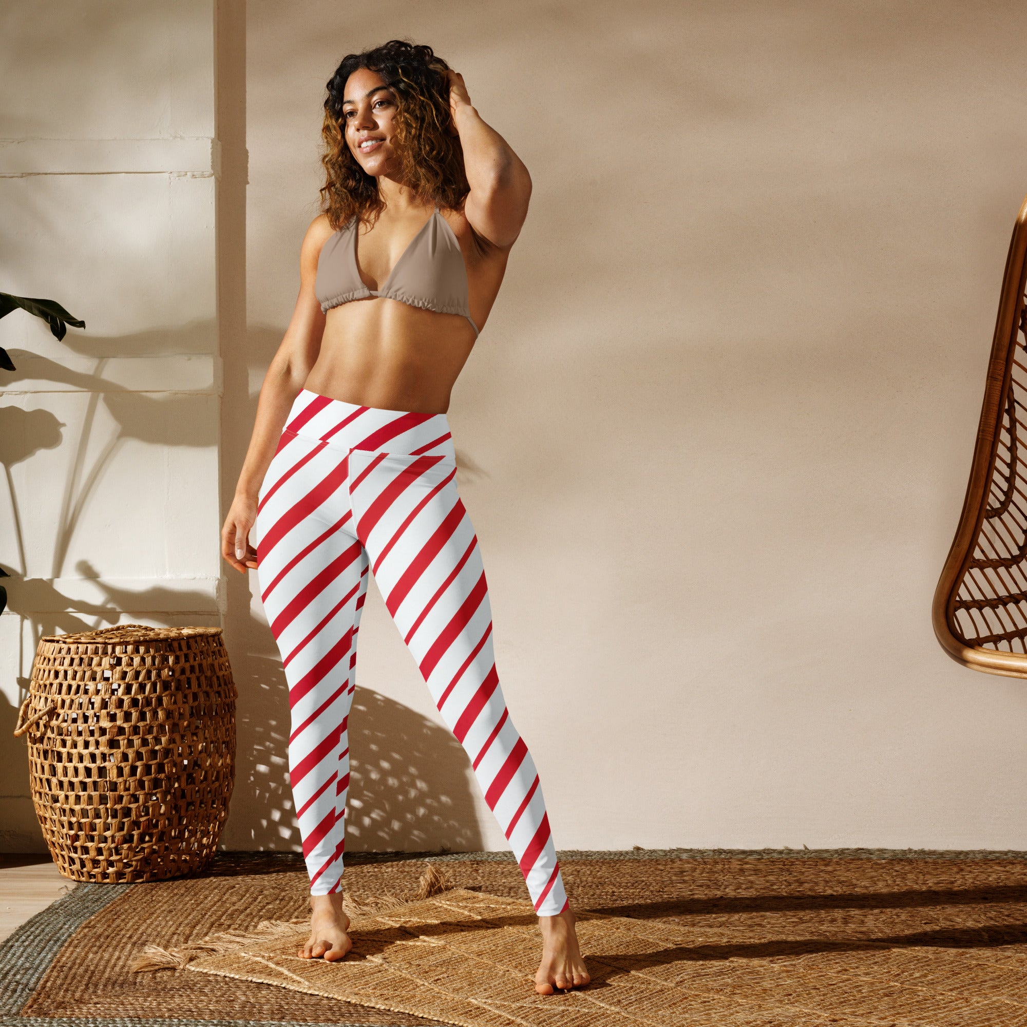 Women’s candy cane stripe buttery soft high-waisted leggings in red and white diagonal stripes for yoga and casual wear