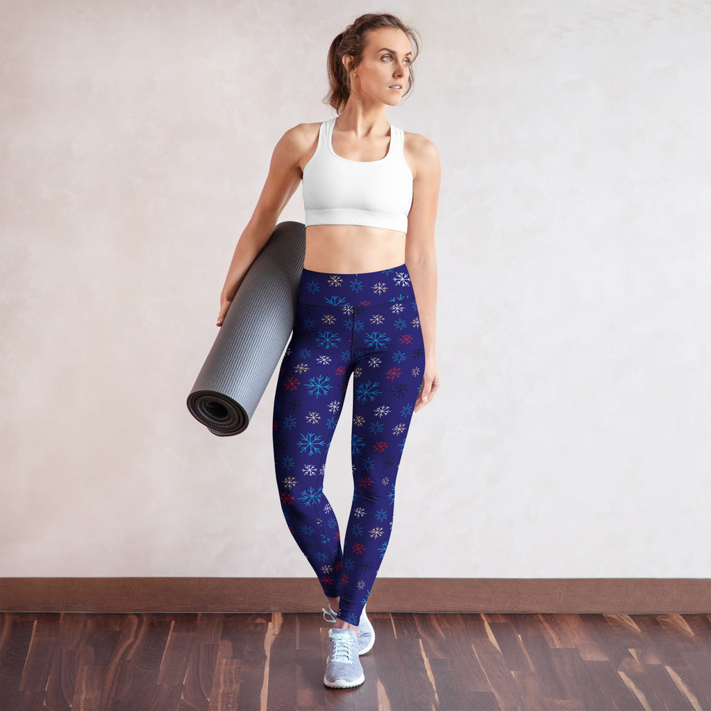 Women’s navy buttery soft yoga leggings with multicolored snowflake pattern in dark blue fabric
