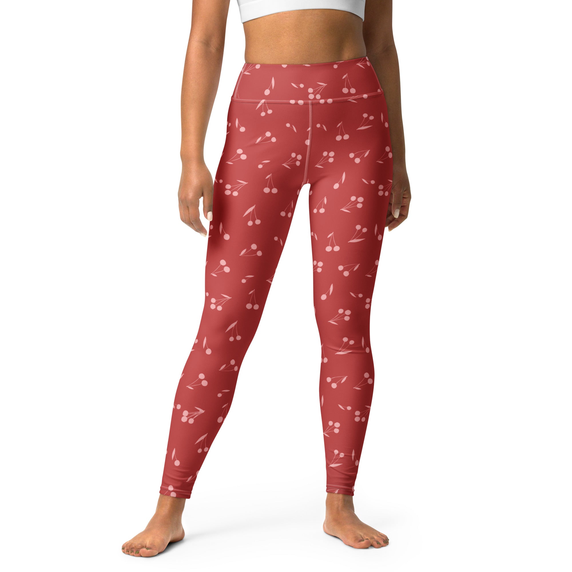 Women’s red cherry print buttery soft high-waisted yoga leggings with a vibrant cherry pattern visible from the front