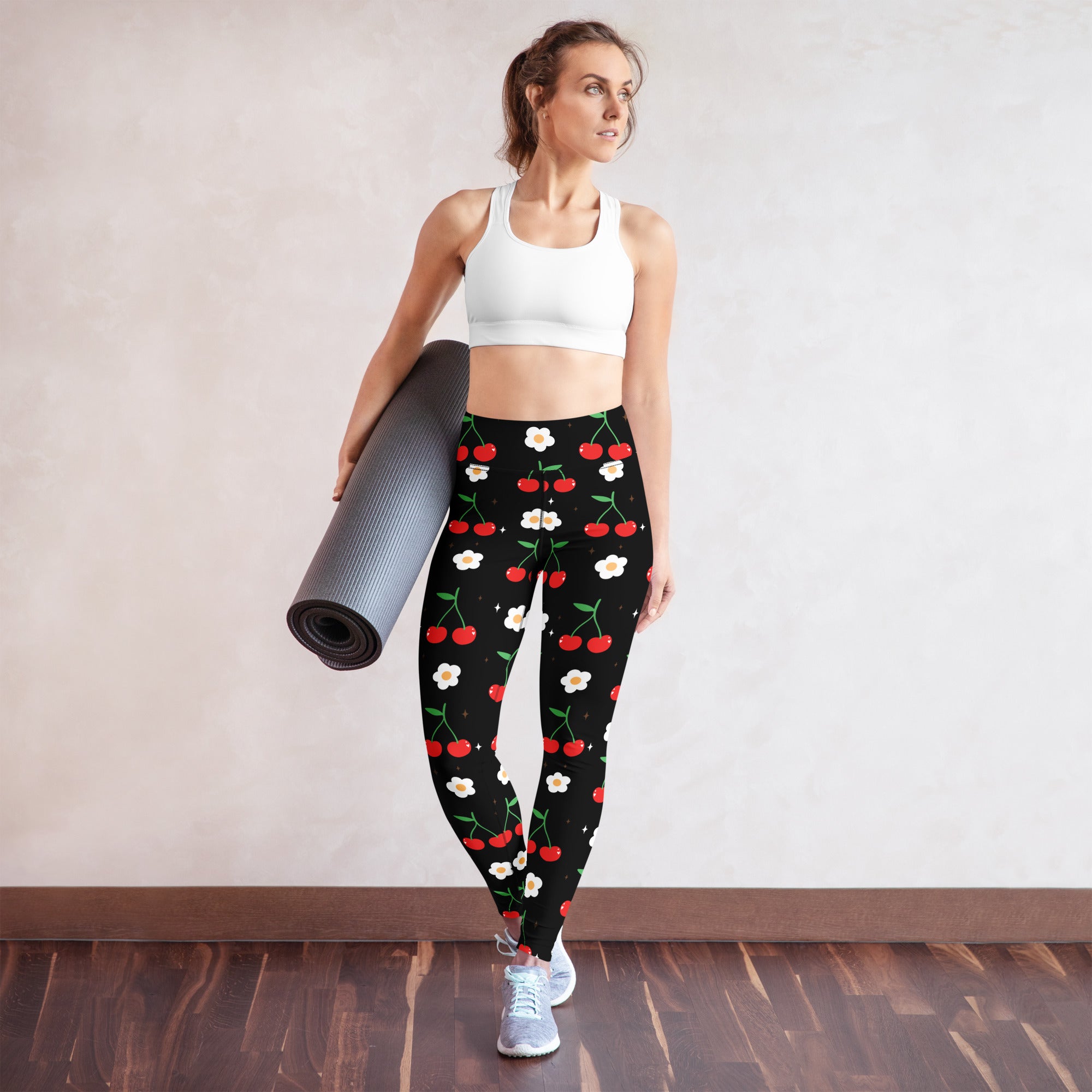 Women’s black cherry blossom buttery soft yoga leggings with playful red cherries and white flower pattern