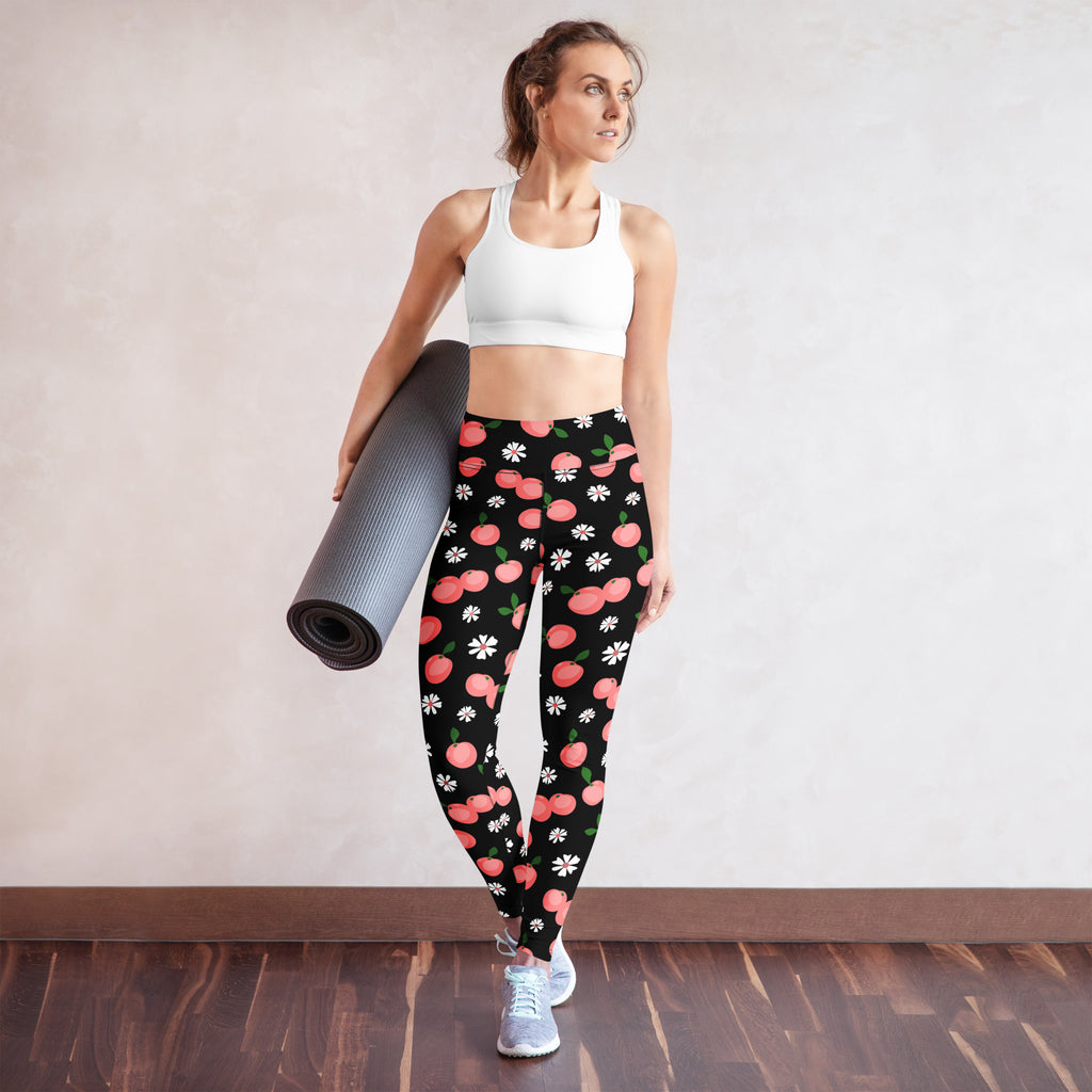 Women’s peach floral buttery soft black yoga leggings with playful pink peaches and white daisies pattern