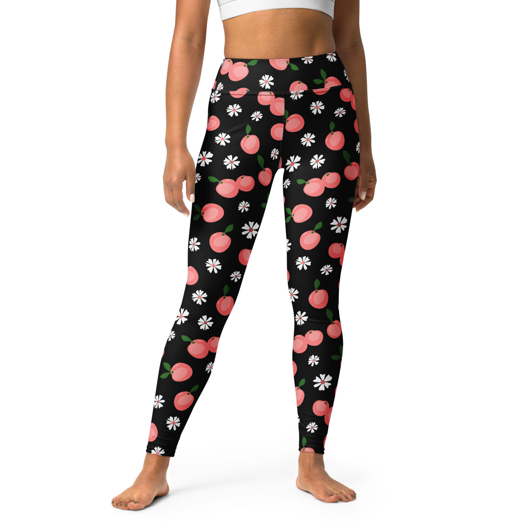 Women’s peach floral buttery soft black leggings with pink cherry and white daisy pattern for yoga and casual wear