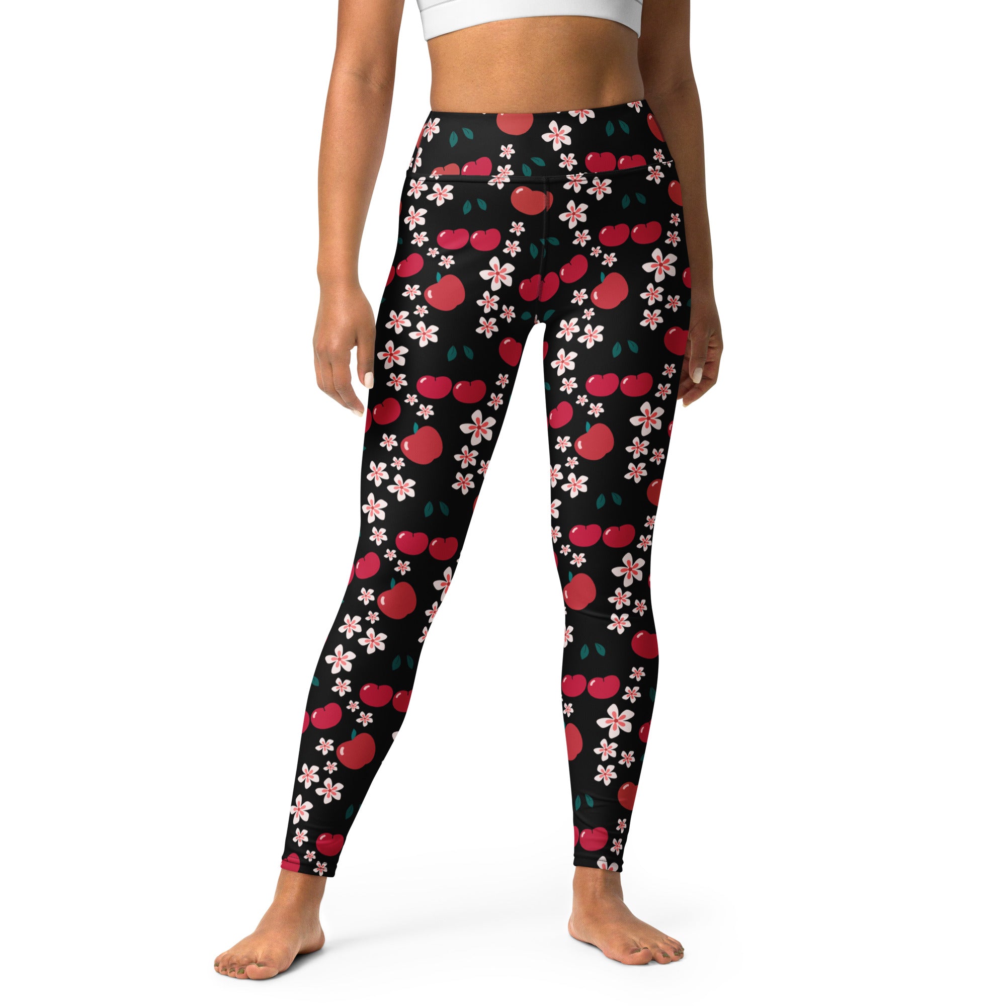 Women’s apple blossom buttery soft black leggings with vibrant red cherry and pink flower pattern for yoga