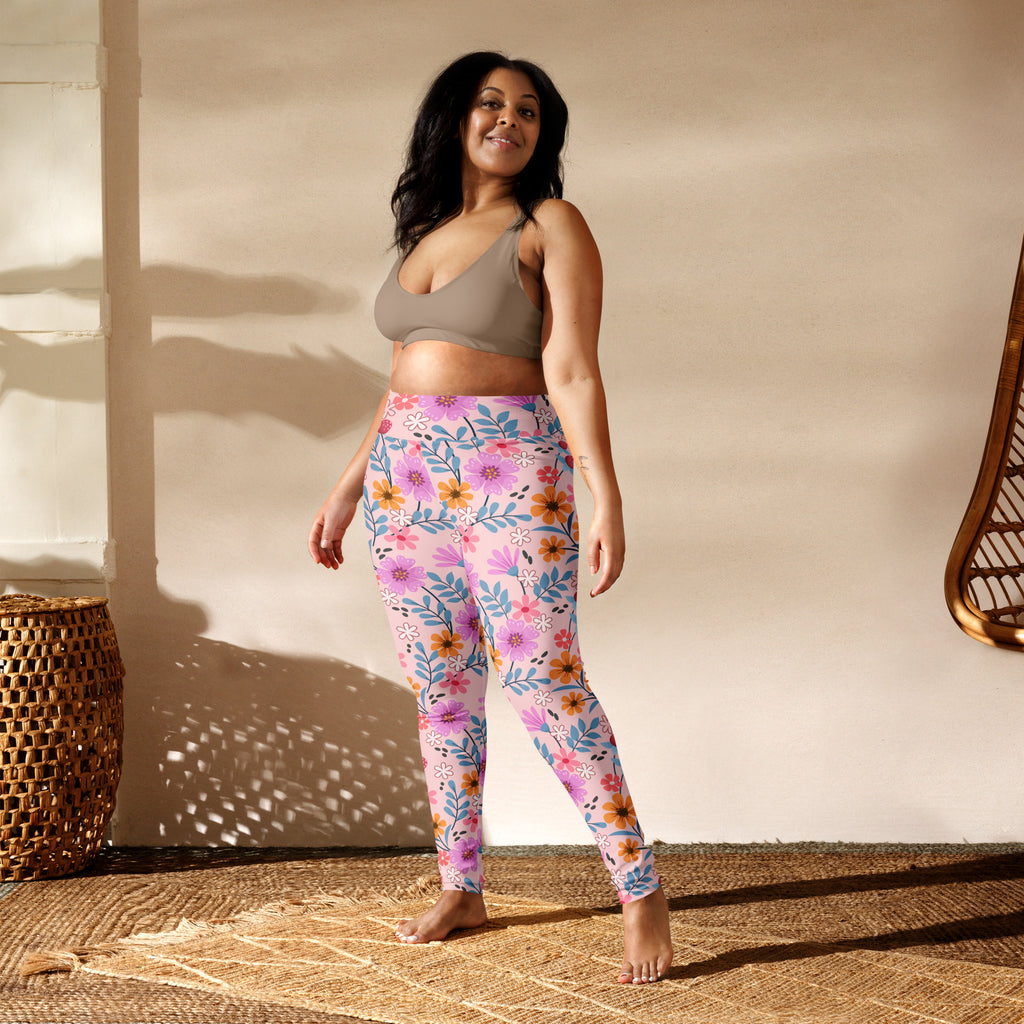 Women’s pink and purple floral patterned buttery soft yoga leggings with high waistband for comfort and flexibility