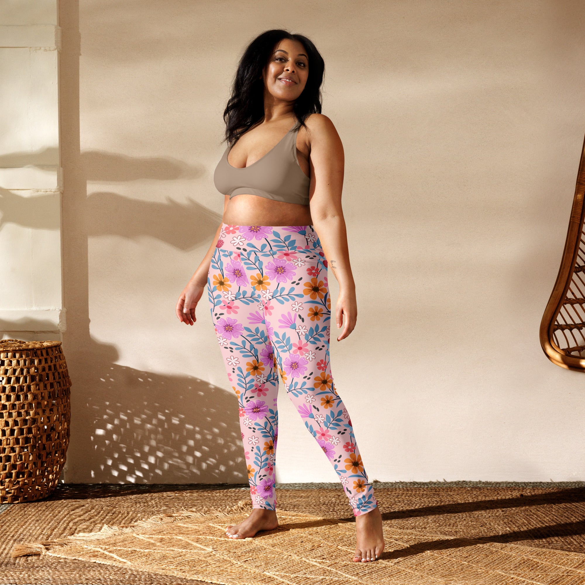 Women’s pink and purple floral patterned buttery soft yoga leggings with high waistband for comfort and flexibility