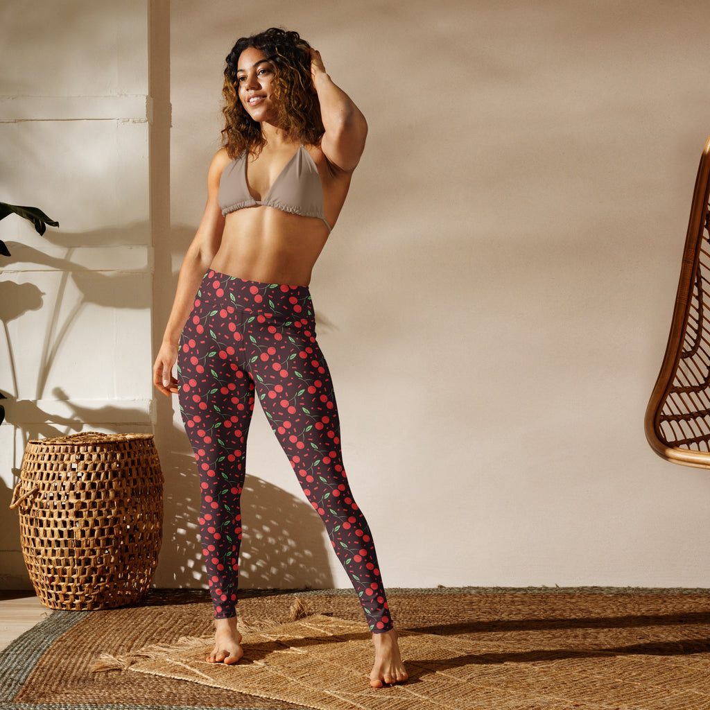 Women’s red cherry buttery soft high-waisted yoga leggings with a dark base and vibrant cherry pattern