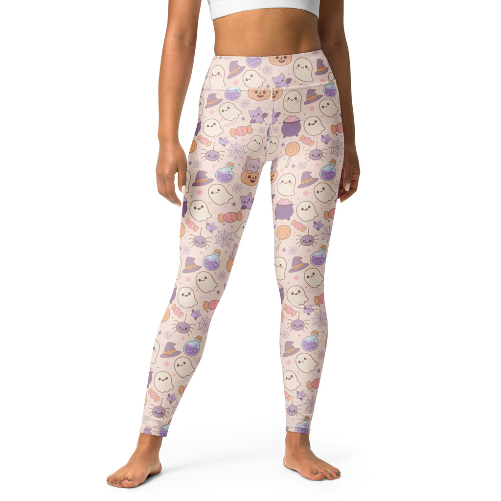 Women’s pastel pink buttery soft yoga leggings with halloween ghost cat spider and witch hat pattern