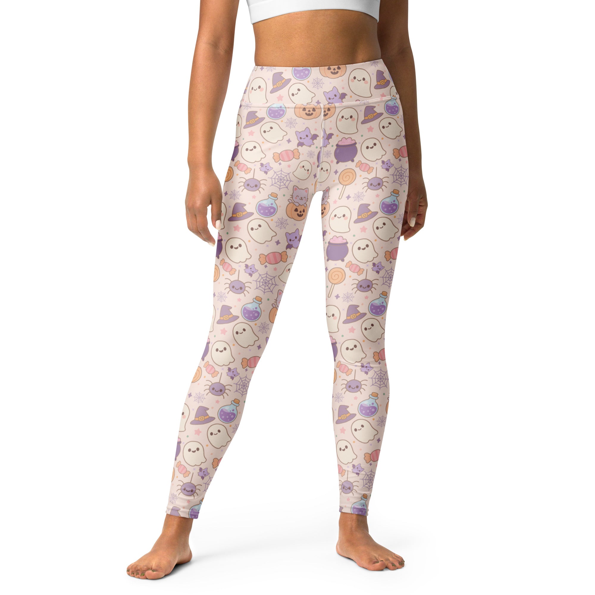 Women’s pastel pink buttery soft yoga leggings with halloween ghost cat spider and witch hat pattern