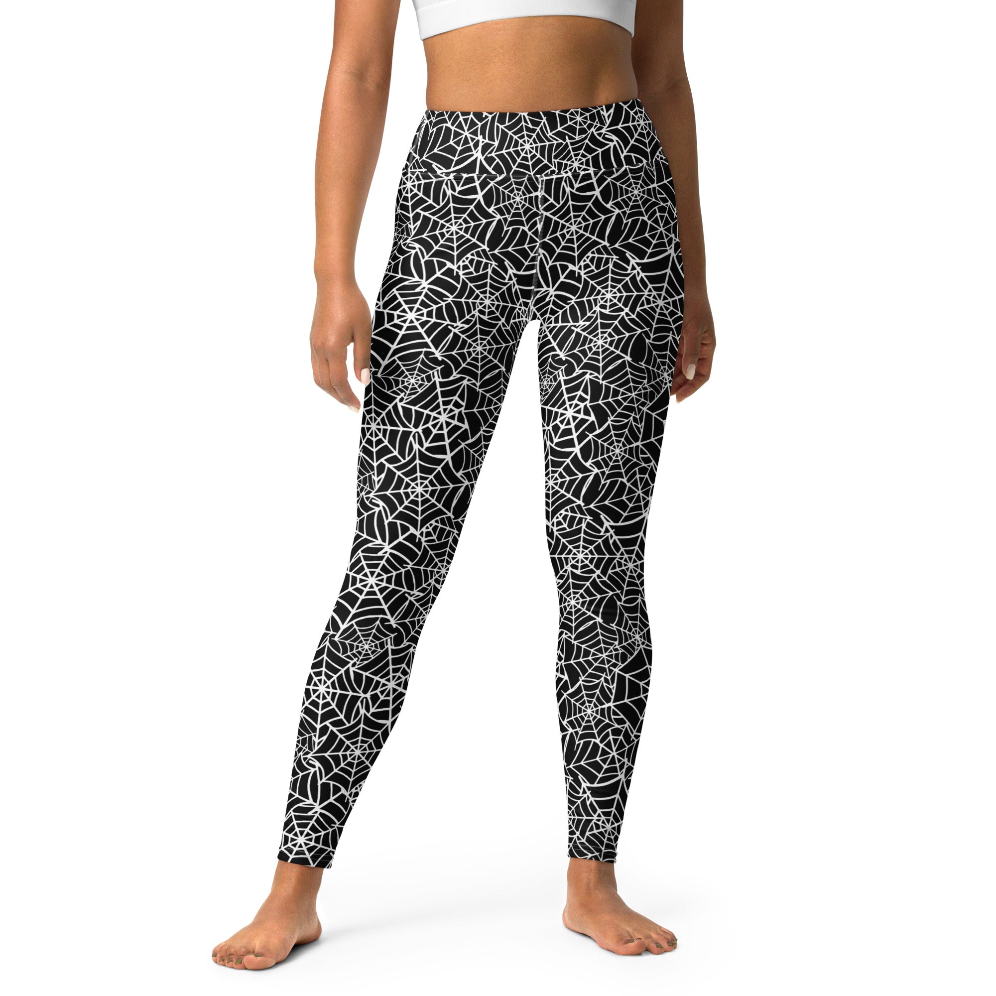 Black women’s buttery soft yoga leggings with white spiderweb pattern perfect for Halloween wear