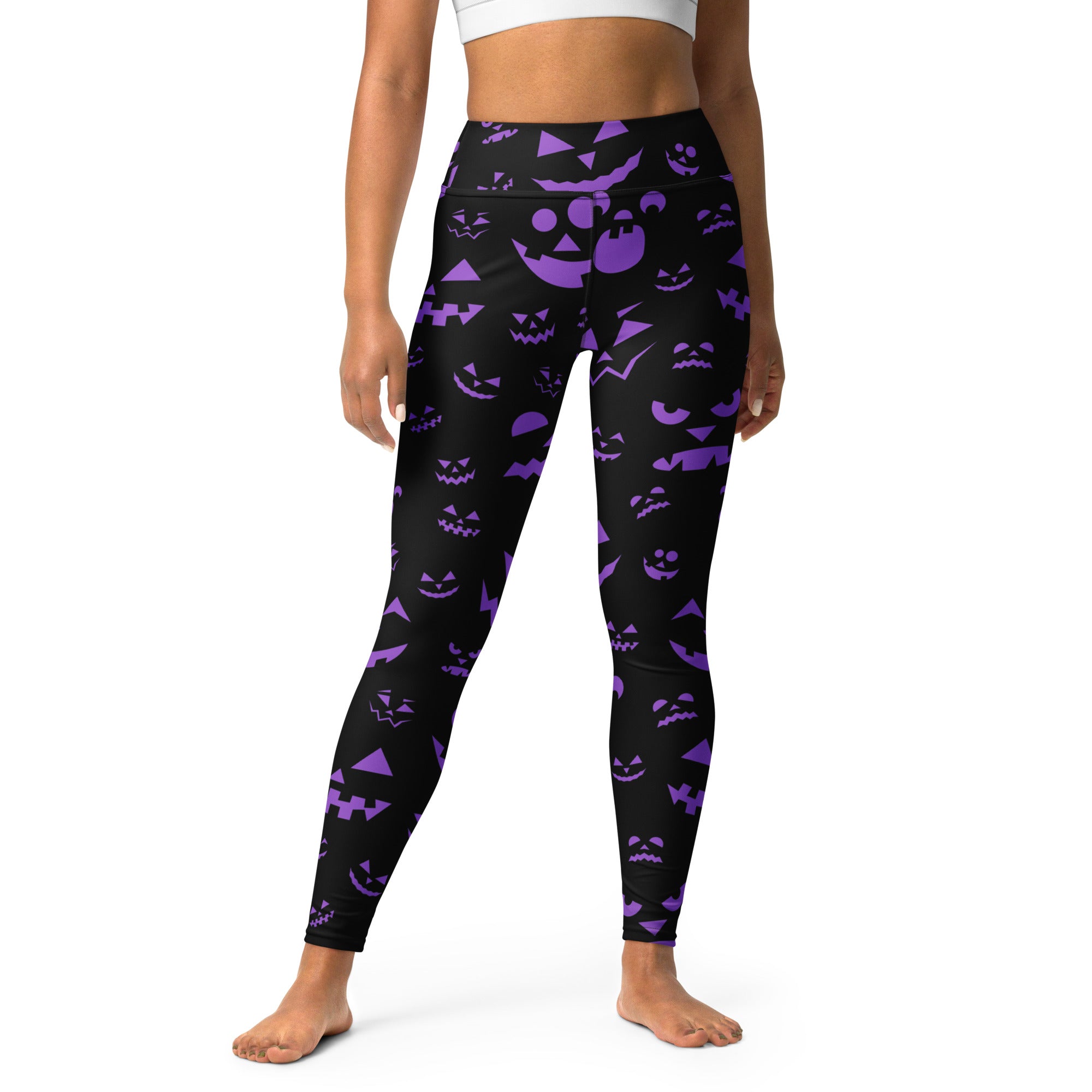 Black high-waisted buttery soft yoga leggings with vibrant purple jack-o-lantern faces for women