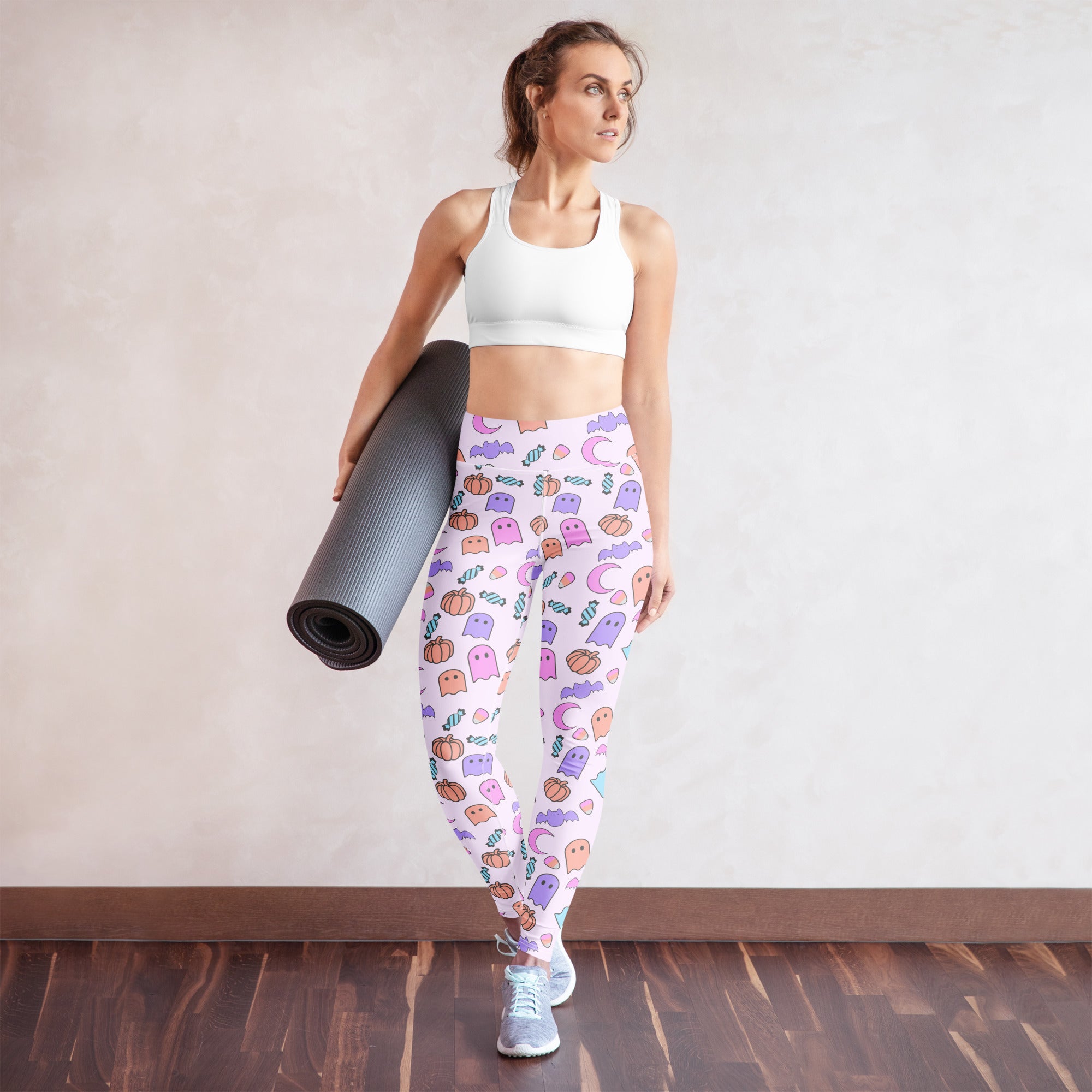 White buttery soft women’s yoga leggings with pastel ghost pumpkin and candy cane halloween pattern