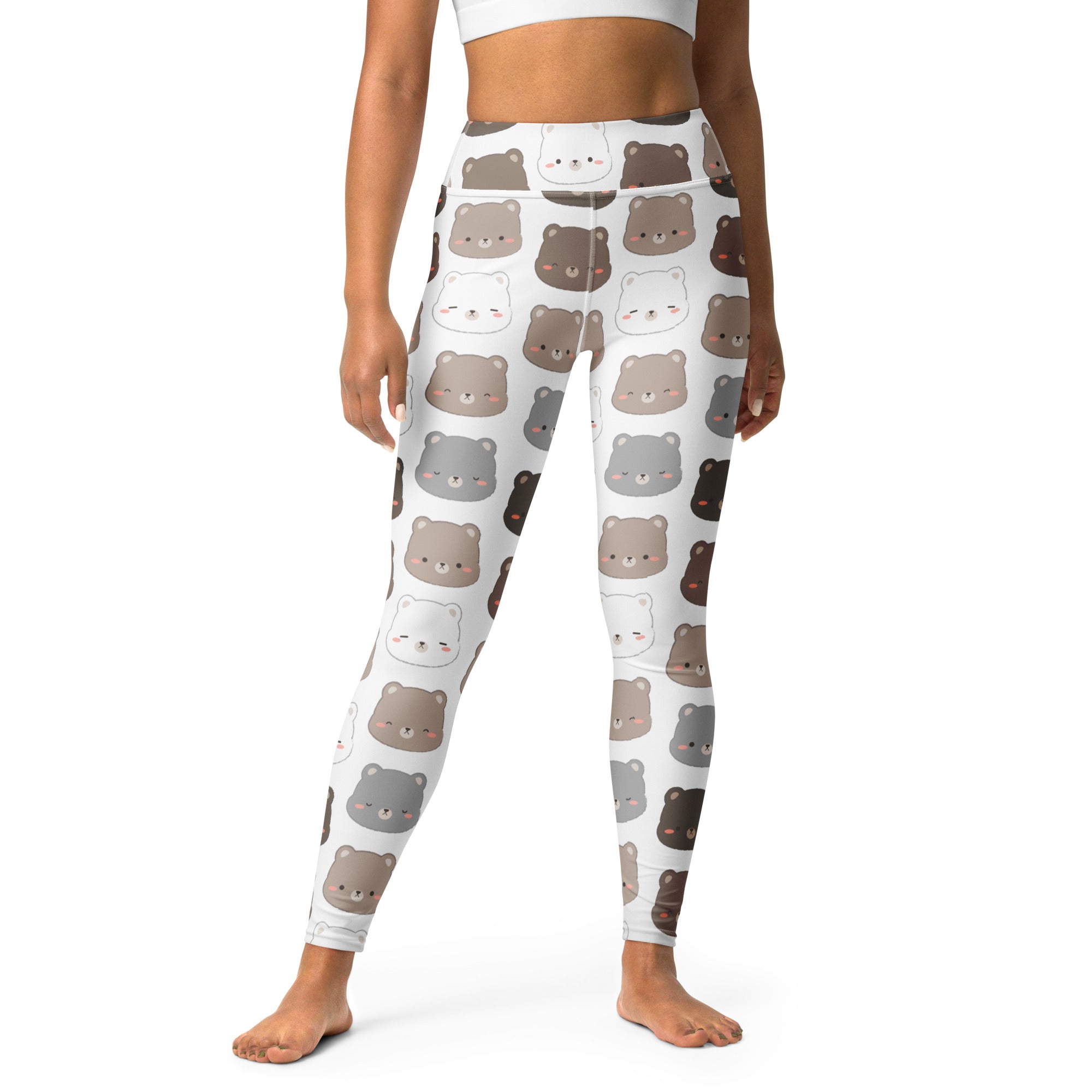 White buttery soft yoga leggings with repeating cute cartoon bear faces in shades of brown gray and black