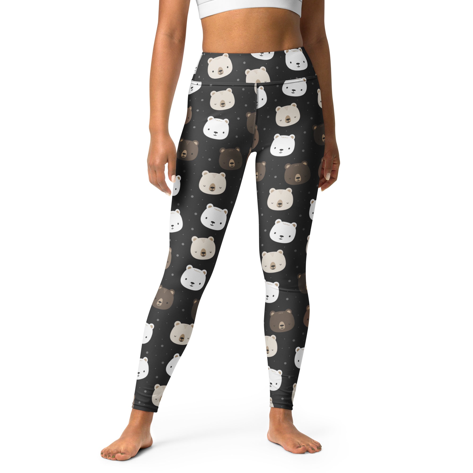 Black high-waisted buttery soft yoga leggings with a playful pattern of white and brown cartoon bear faces
