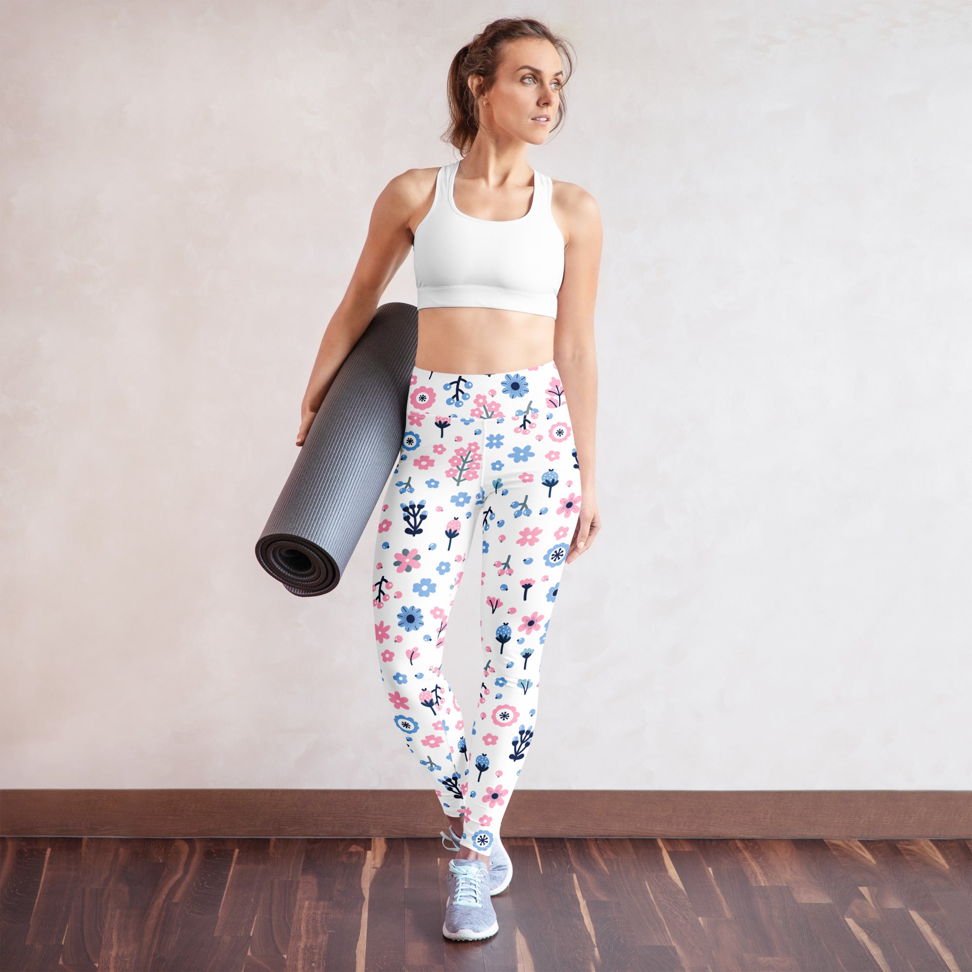 White women’s pastel floral buttery soft yoga leggings with pink blue and black flower and tree pattern
