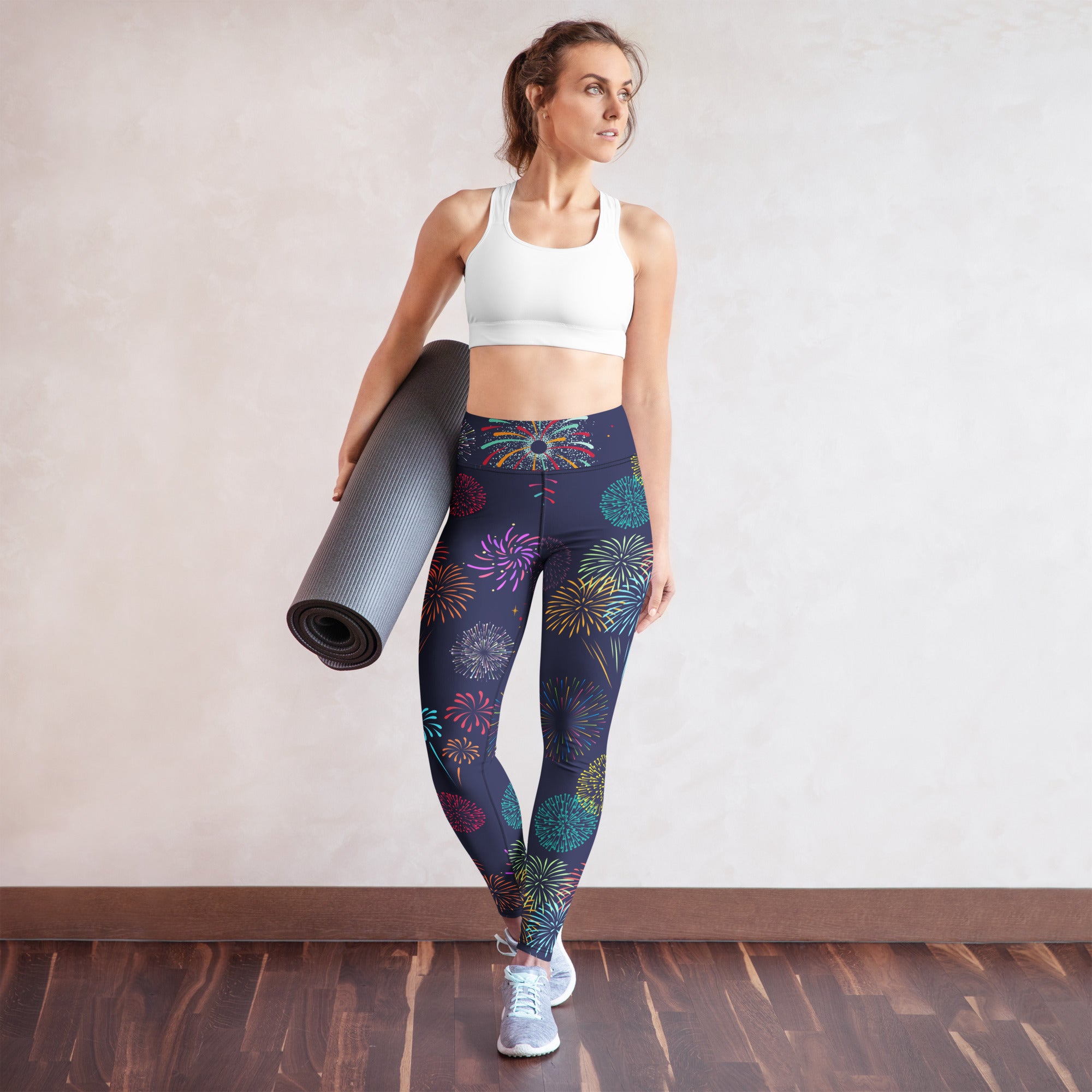 Women’s dark blue buttery soft yoga leggings with vibrant multicolored fireworks pattern for active wear