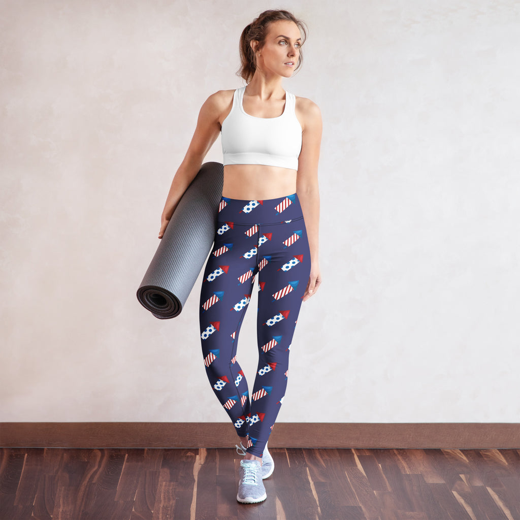 Navy buttery soft women’s yoga leggings with playful red white and blue rocket and star pattern for 4th of july