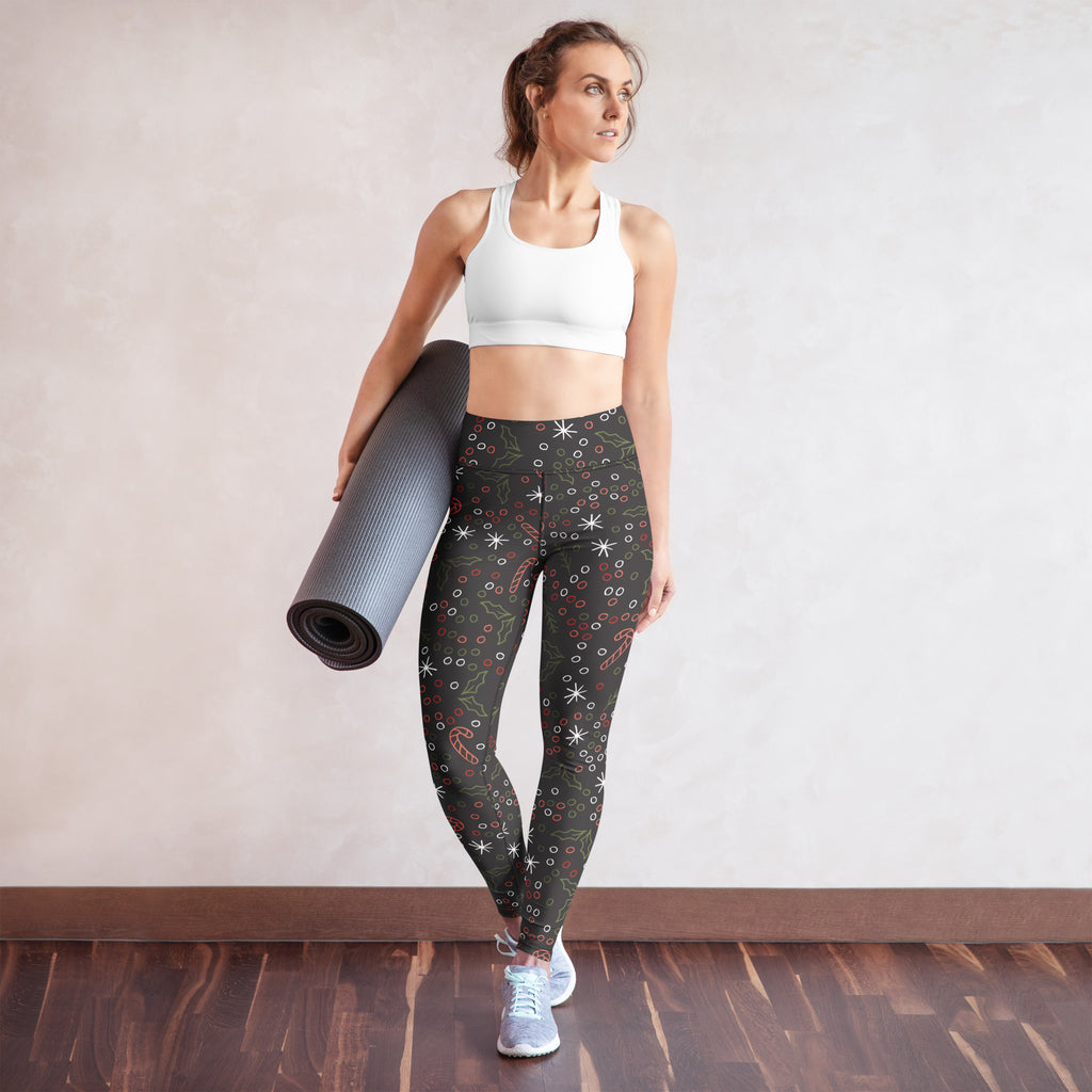 Women’s dark gray buttery soft yoga leggings with dark green festive pattern of stars candy canes and holly leaves