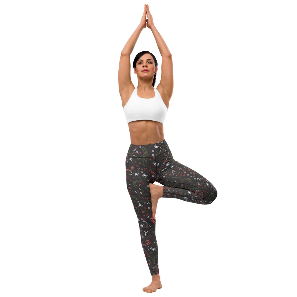 Women’s dark gray buttery soft yoga leggings with festive red and white stars candy canes and snowflakes pattern