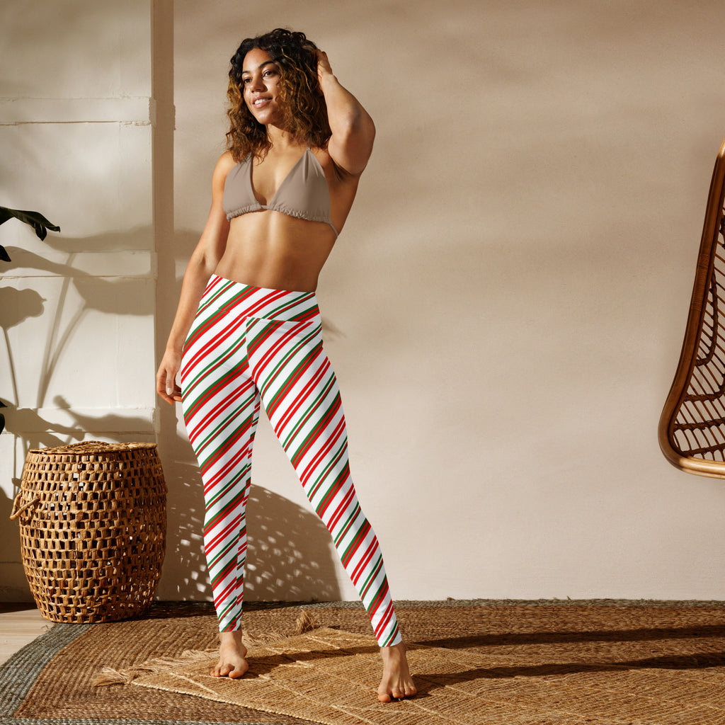 Women’s buttery soft yoga leggings in red green and white candy cane stripe with a high waisted design