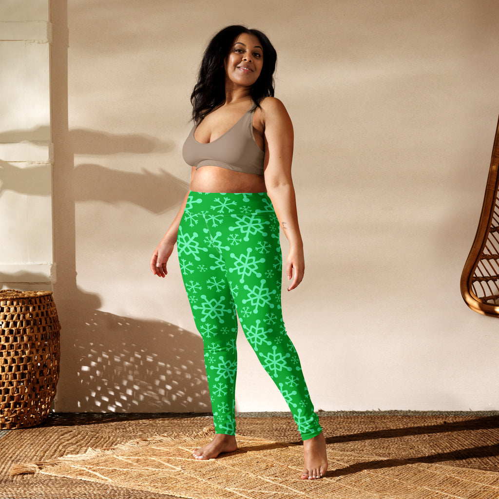 Women’s green buttery soft yoga leggings with bright green color and light teal snowflake pattern