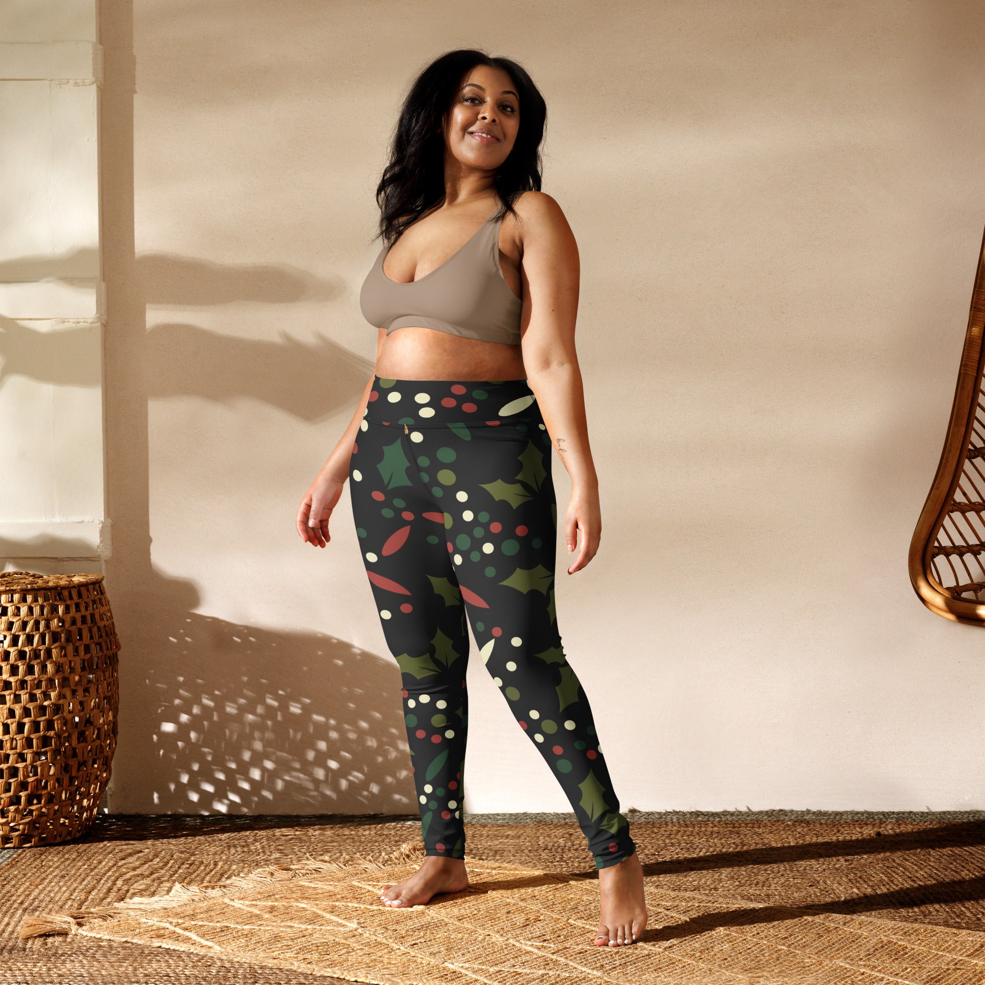 Women’s holly berry buttery soft yoga leggings in black with festive green holly leaves red and white polka dots pattern