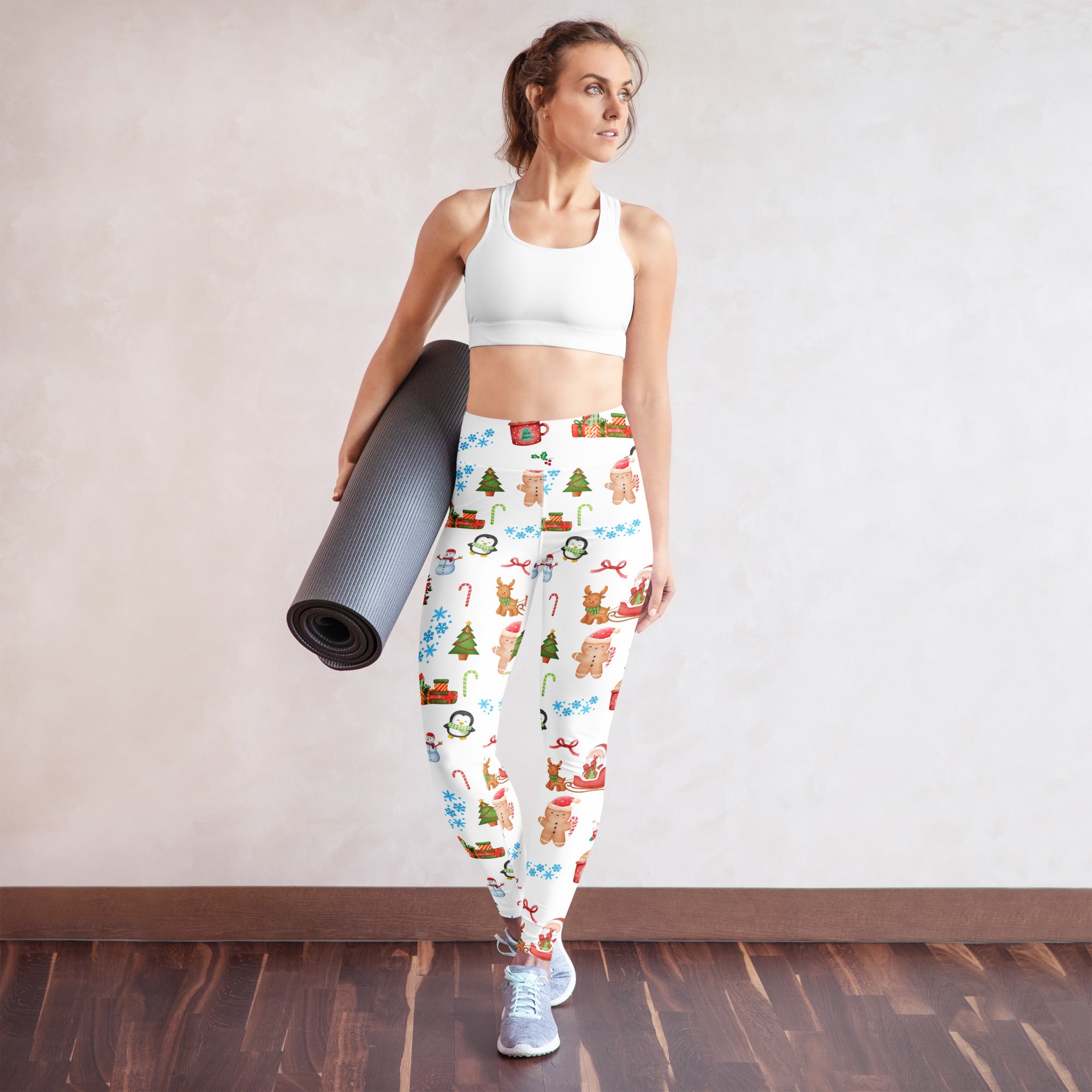 White buttery soft women’s yoga leggings with festive holiday pattern of gingerbread men candy canes and snowflakes