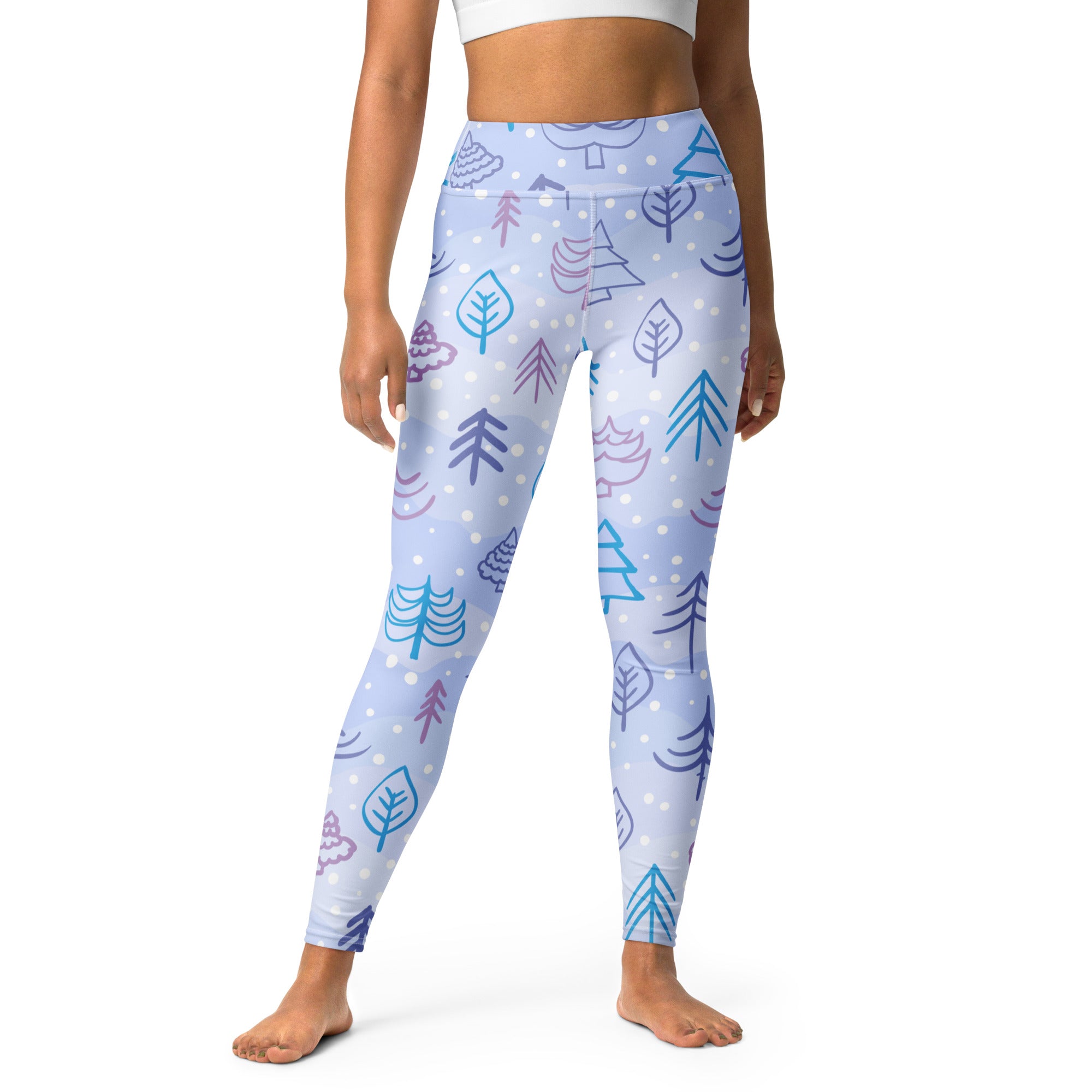 Women’s winter themed buttery soft light blue yoga leggings with teal purple and pink tree and leaf patterns