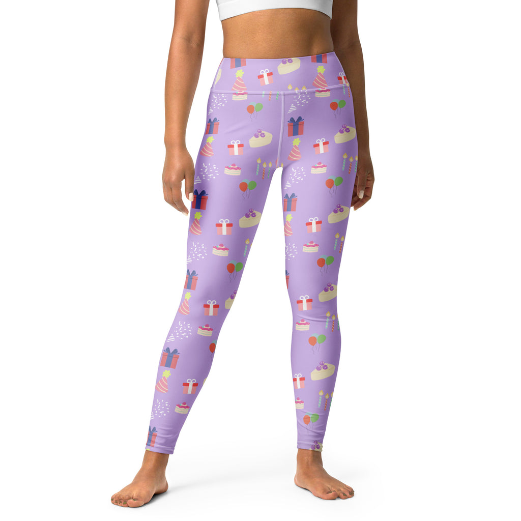 Women’s purple buttery soft yoga leggings with a playful birthday cake gift and candle pattern in pastel colors