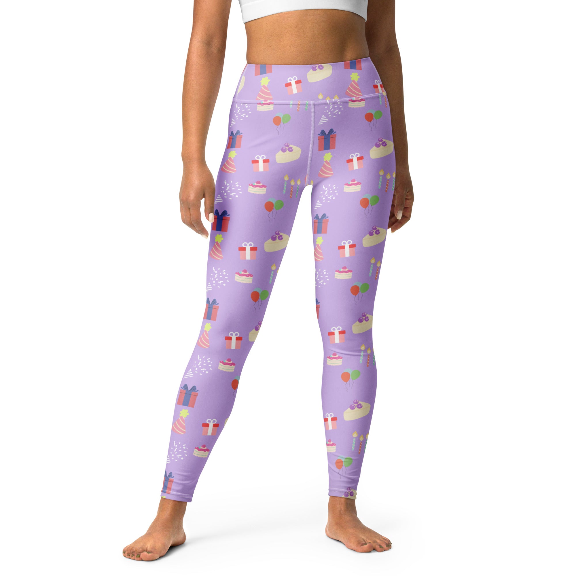 Women’s purple buttery soft yoga leggings with a playful birthday cake gift and candle pattern in pastel colors
