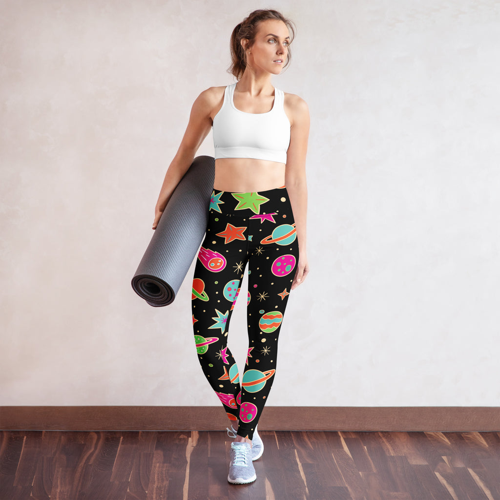 Women’s neon galaxy buttery soft black leggings with colorful planets and stars in a playful space pattern